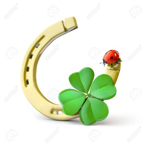 15473327-lucky-symbols-horse-shoe-four-leaf-clover-and-ladybug-stock-photo.jpg